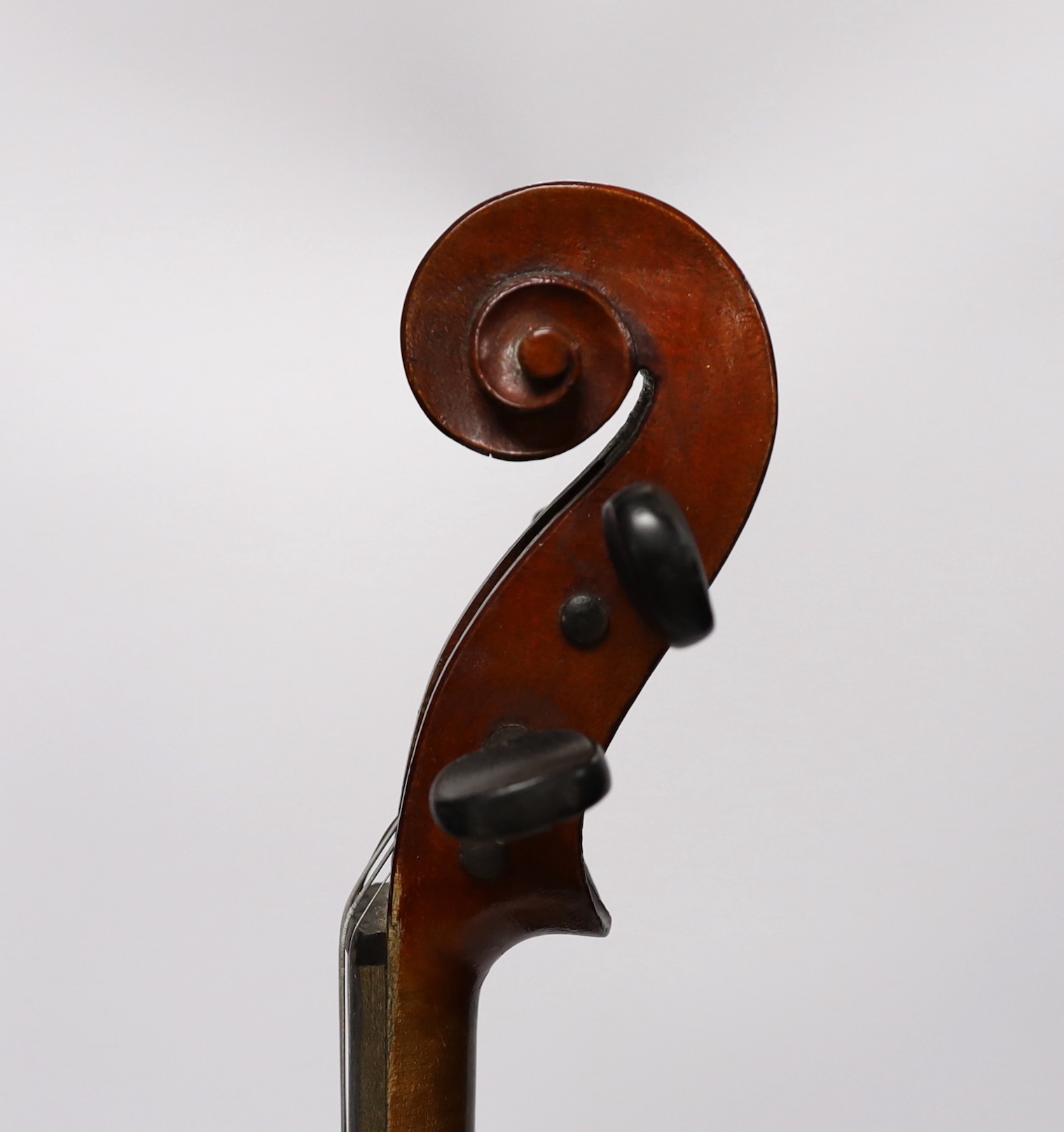 A wooden cased student violin
